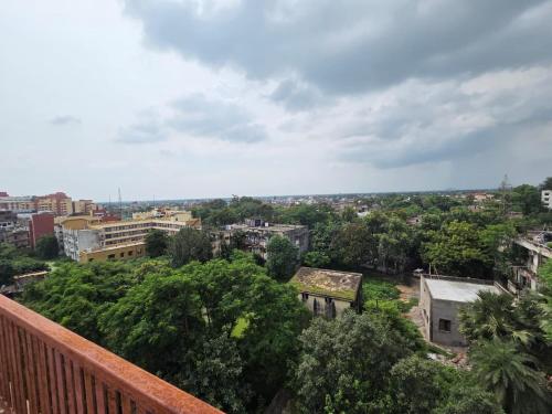 a view of a city from a balcony at The Cozy Petals in Gaya