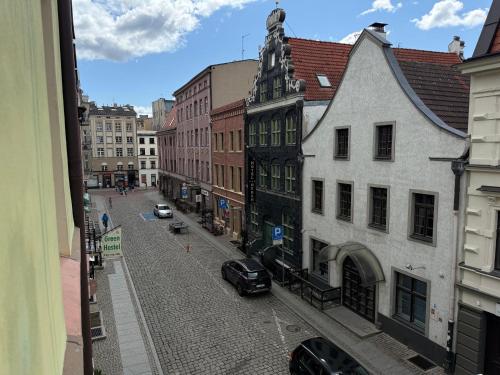 a view of a street in a city with buildings at Apartament Wszystkie Gwiazdy Kopernika in Toruń