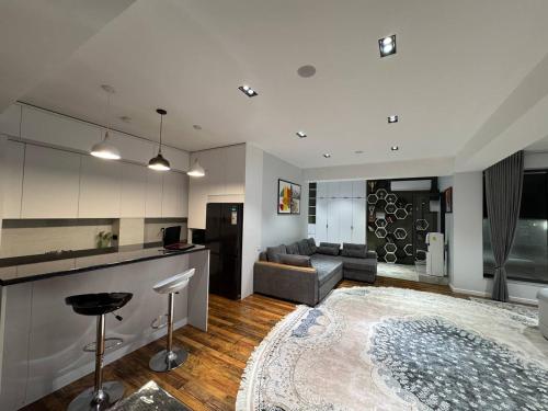 a large living room with a couch and a table at Bukhara Penthouse in Bukhara