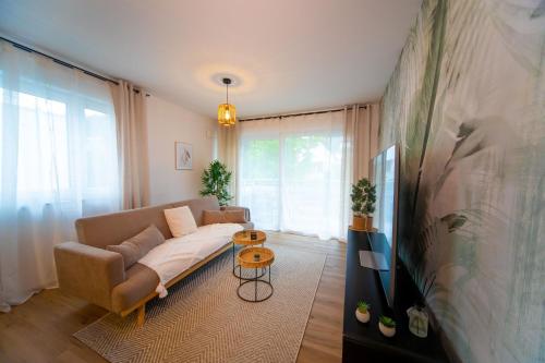 a living room with a couch and a tv at P-Hosting BohoStyle Rv1 in Ravensburg