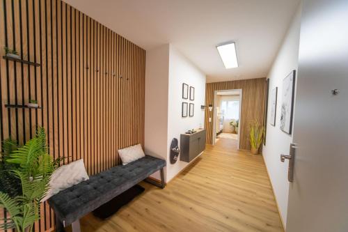 a hallway with a bench in a room at P-Hosting BohoStyle Rv1 in Ravensburg