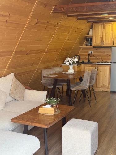 a living room with a couch and a table at IN CLOUDS RESORT Byurakan in Antarut