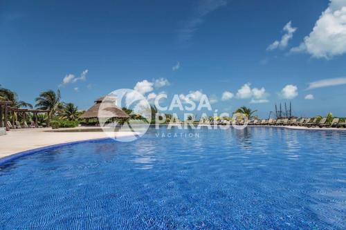 a view of a swimming pool at a resort at ☆BLUE NEST- Beachfront apartment by CASA PARAISO☆ in Cancún