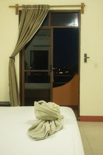 Una cama o camas en una habitación de Bacanda Hotel
