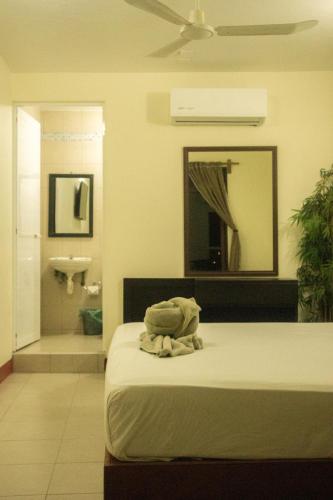 Una cama o camas en una habitación de Bacanda Hotel