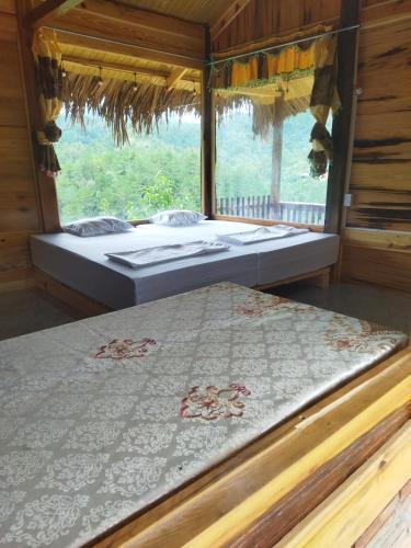 Postel nebo postele na pokoji v ubytování Nature Homestay Mù Cang Chải