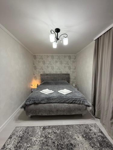 Katil atau katil-katil dalam bilik di Apartament Privat Botanica