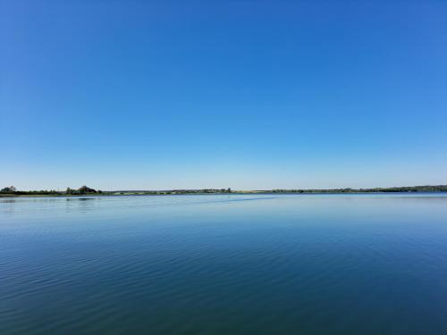 a view of a large body of water at Domek nad jeziorem Chłop in Lipiany