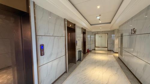 a hallway of an office building with a elevator at NAGA Frontier in Vientiane
