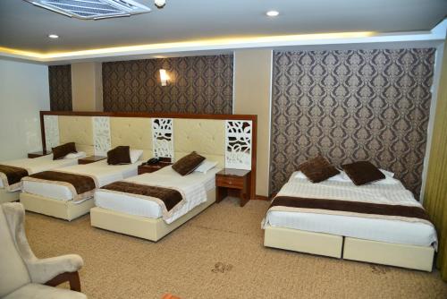 Katil atau katil-katil dalam bilik di Dynasty Hotel