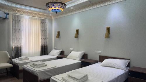 Кровать или кровати в номере Al Amin Hotel