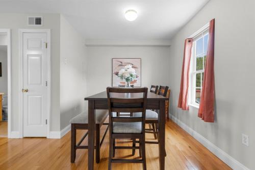 a dining room with a table and chairs at Near YALE - Beautiful Waterfront Townhouse in New Haven in New Haven