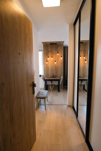 a hallway with a dining room with a table at Cloud 9 in Bratislava