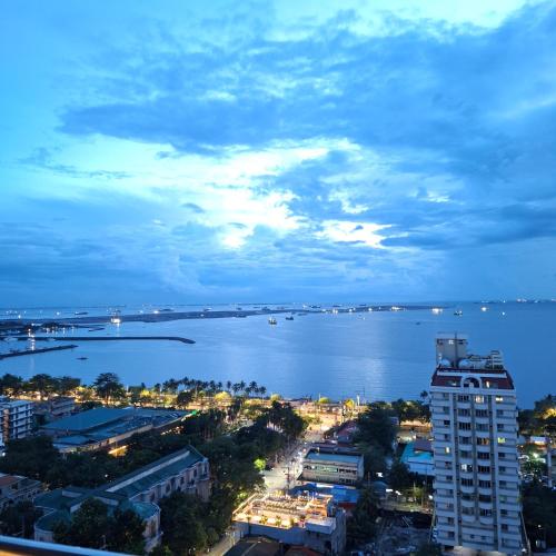 a view of a city and a large body of water at BREATHTAKING BAYVIEWS - 1-5 BR Luxury and Superior Condos with Panoramic Bay Views, Balcony, Gym, Pool & Netflix - Housekeeping Available - in Manila