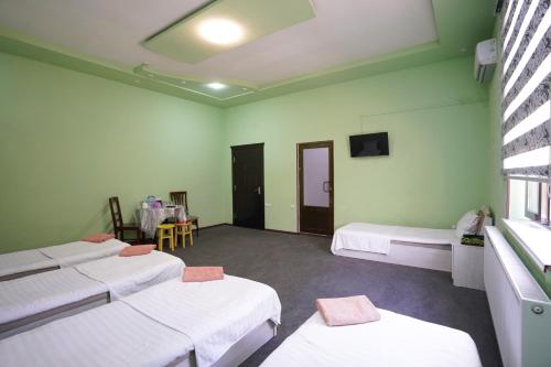 Ένα ή περισσότερα κρεβάτια σε δωμάτιο στο Luxe Hotel