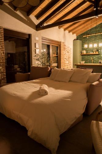 a bedroom with a large bed in a room at El Corral de Cayetana in Valdemierque