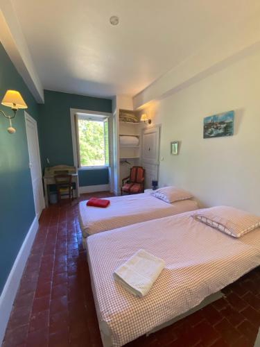 Postel nebo postele na pokoji v ubytování La Combe Darroux