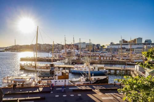 a group of boats docked in a harbor at Oslo City Centre - Fortress & sea view in Oslo