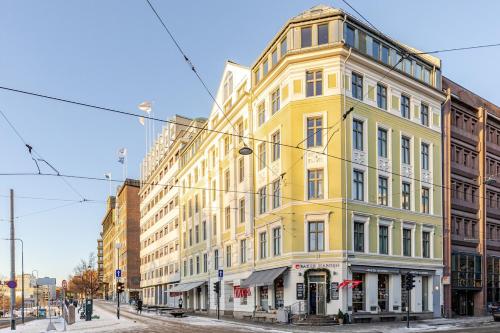 a yellow building on the corner of a street at Oslo City Centre - Fortress & sea view in Oslo