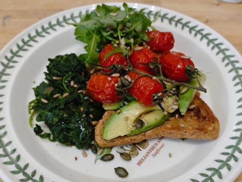 a plate of food with vegetables on top of toast at Anton Guest House Bed and Breakfast in Shrewsbury