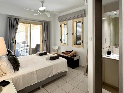 Ένα ή περισσότερα κρεβάτια σε δωμάτιο στο Olive Apartment