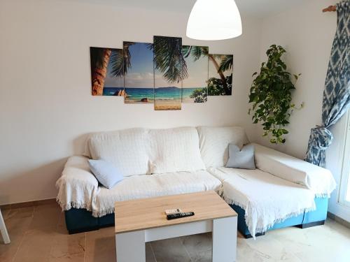 a living room with a couch and a table at Plaza de la Vendimia in Manilva