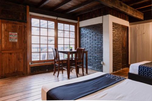 Ένα ή περισσότερα κρεβάτια σε δωμάτιο στο Capital O Hotel Villa Azura