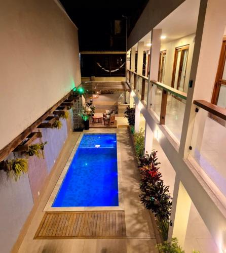 an indoor swimming pool in a building at Terra Bella Pousada in Morro de São Paulo