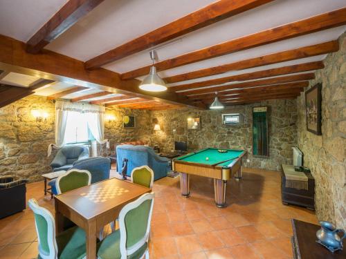 a living room with a ping pong table at Holiday Home in Arcozelo with Private Pool in Ponte de Lima