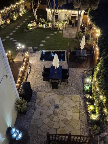 an aerial view of a patio at night with lights at Appletorre House Holiday Flats - Pet Friendly by arrangement and Private Parking in Torquay