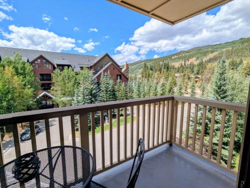 a view from the balcony of a house with chairs at Red Hawk Lodge 2295 by SummitCove Lodging in Keystone