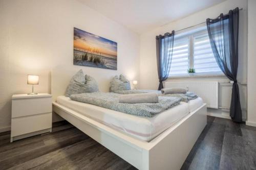 Postel nebo postele na pokoji v ubytování Ferienwohnung Heide I