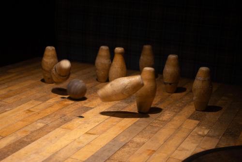 a group of wooden chess pieces on a wooden table at Colcombe Castle Hotel in Colyton