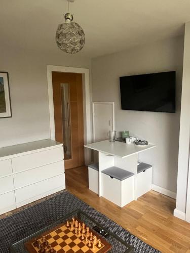 a living room with a chess board on the floor at 3 bed self contained part house in Queensferry, Edinburgh in Queensferry