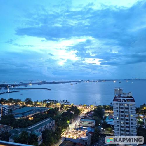 a view of a city and a large body of water at BREATHTAKING BAYVIEWS - 1-5 BR Luxury and Superior Condos with Panoramic Bay Views, Balcony, Gym, Pool & Netflix - Housekeeping Available - in Manila