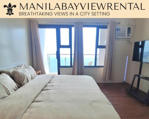 a large bed in a room with windows at BREATHTAKING BAYVIEWS - 1-5 BR Luxury and Superior Condos with Panoramic Bay Views, Balcony, Gym, Pool & Netflix - Housekeeping Available - in Manila