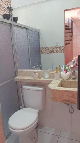 a bathroom with a toilet and a sink at Casa da Vovó - COP 30 in Belém