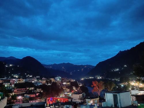 a view of a city at night at Geetanjali Palace Hotel & Restaurant in Rudraprayāg