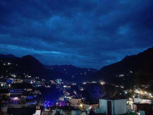 a view of a city at night at Geetanjali Palace Hotel & Restaurant in Rudraprayāg