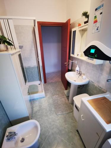 a bathroom with a sink and a toilet and a shower at Blu Amalfi in Gizzeria