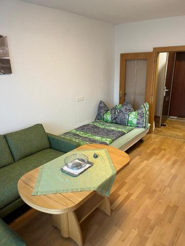 a living room with a couch and a table at Tina`s Ferienwohnung in Kapfenberg