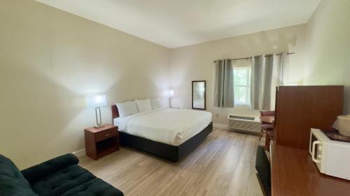 Ένα ή περισσότερα κρεβάτια σε δωμάτιο στο Westhaven Inn