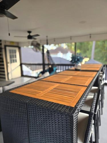 a table on the back of a boat with chairs at "Fitz-Just-Right" Family-Friendly Fun, Games! in Honea