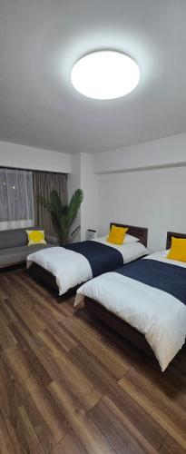 Ένα ή περισσότερα κρεβάτια σε δωμάτιο στο New happy house -m2