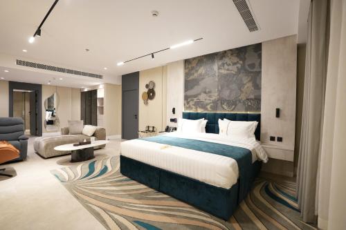 a hotel room with a bed and a couch at Casablanca Elite in Jeddah