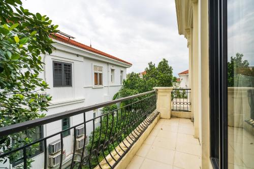 a balcony with a view of a building at Lumiere Villa Splendora An Khánh in Vân Lũng