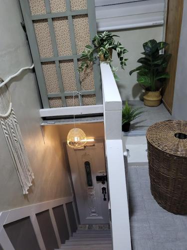 a stairway with a door with plants on it at Sea House in Busan