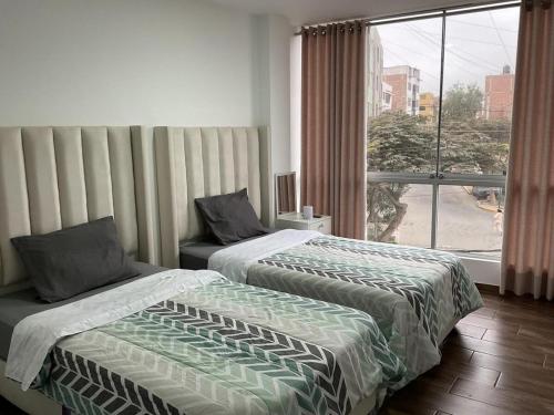 Ένα ή περισσότερα κρεβάτια σε δωμάτιο στο Hospedaje Sagitario