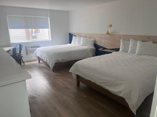 Ένα ή περισσότερα κρεβάτια σε δωμάτιο στο The Varsity Inn North