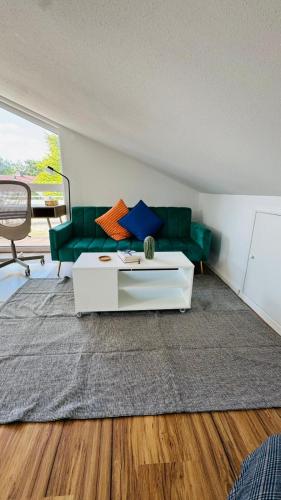 a living room with a couch and a table at Luxury Apartment in Böblingen in Böblingen